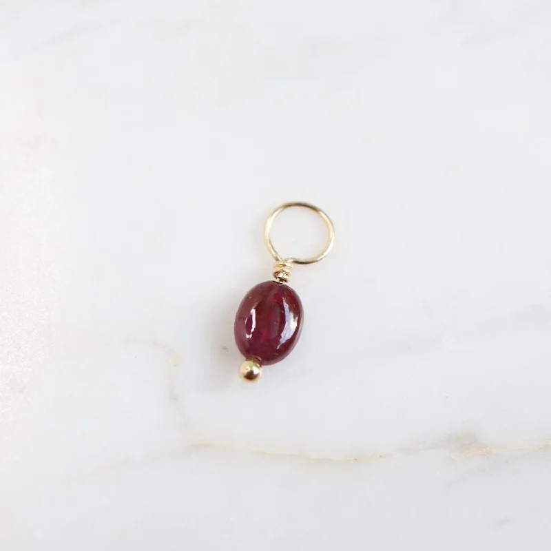 Ruby Unfaceted Oval Gemstone Charm