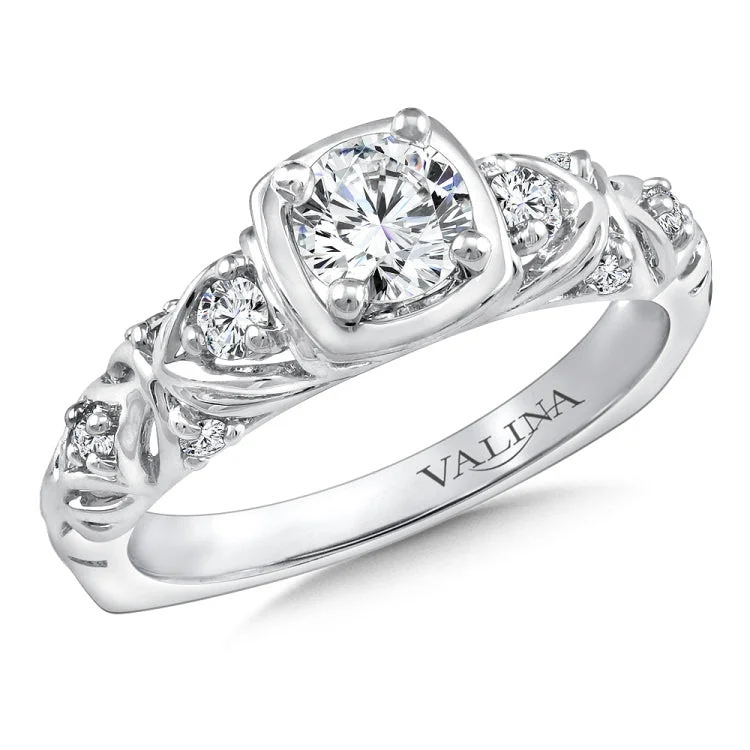 Diamond engagement ring mounting with diamond side stones set in 14k white gold.