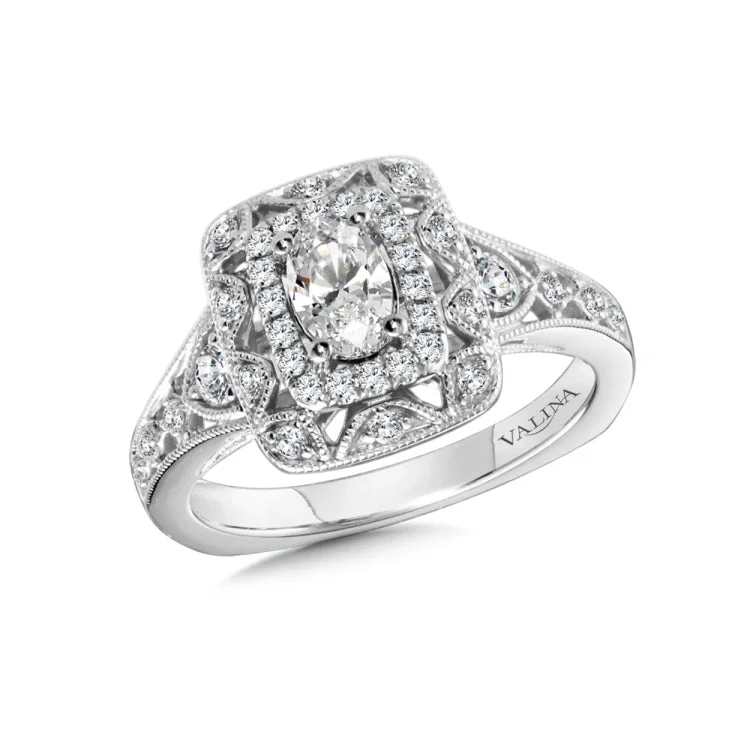 Diamond halo engagement ring mounting in 14k white gold.