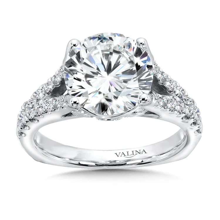 Diamond split shank support the round center stone accented with delicate 14k white gold detailing and secret diamond.