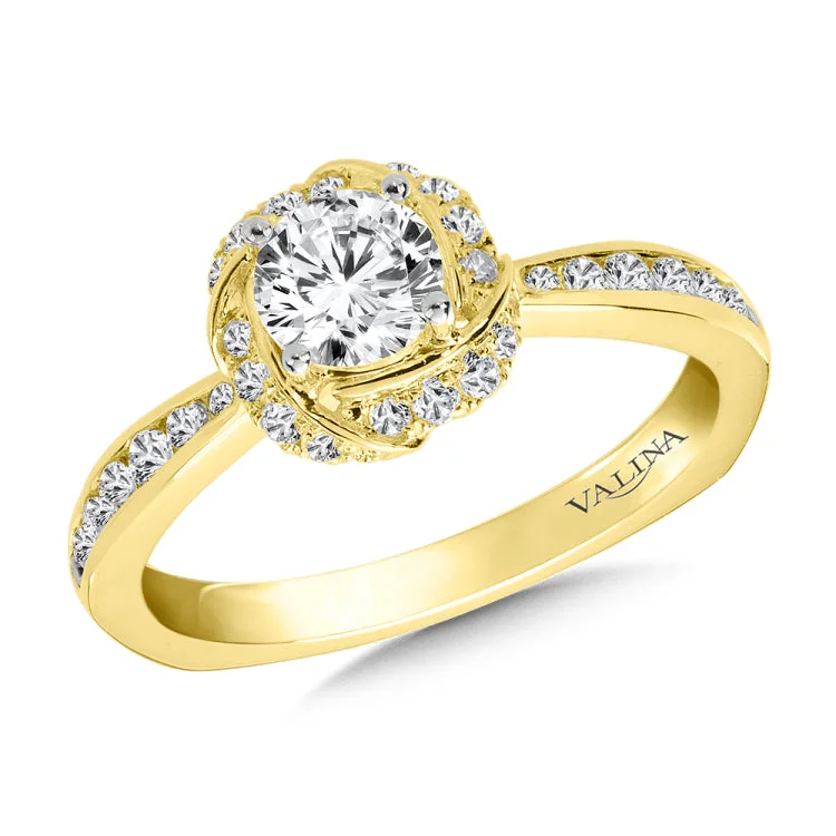 Diamond halo engagement ring mounting with side stones set in 14k yellow gold.