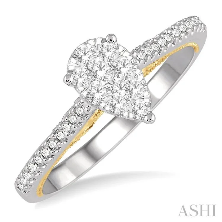 1/3 Ctw Pear Shape Round Cut Diamond Lovebright Ring in 14K White and Yellow gold.